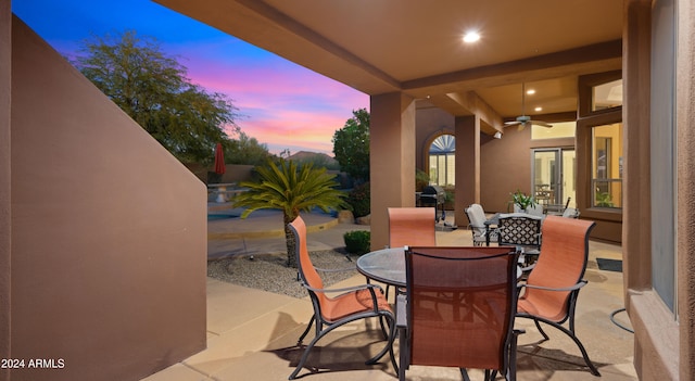 patio terrace at dusk with ceiling fan