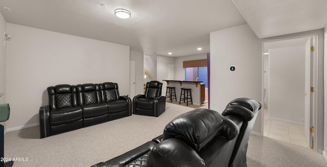 home theater featuring light colored carpet