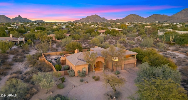 aerial view at dusk with a mountain view