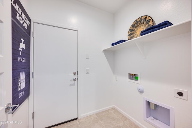 washroom featuring light tile patterned flooring, electric dryer hookup, hookup for a washing machine, and hookup for a gas dryer