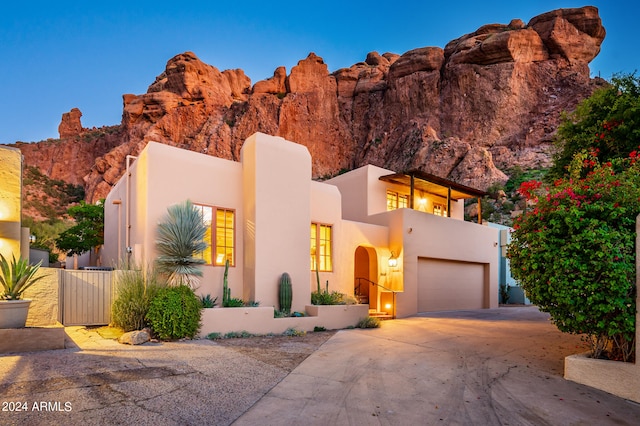 view of front of home featuring a mountain view and a garage