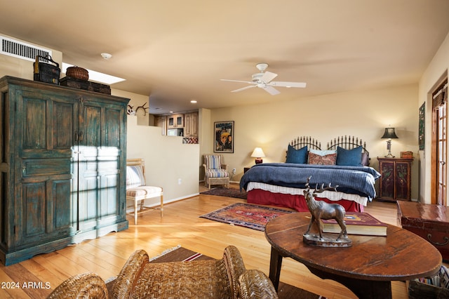 bedroom featuring ceiling fan and light hardwood / wood-style flooring