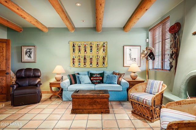 tiled living room featuring beam ceiling