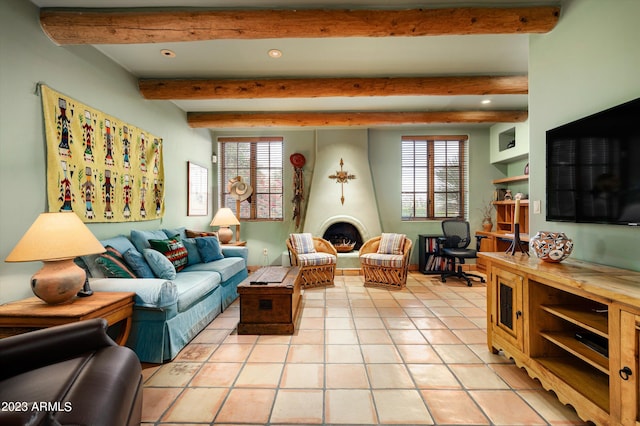 living room featuring plenty of natural light, beam ceiling, and light tile flooring