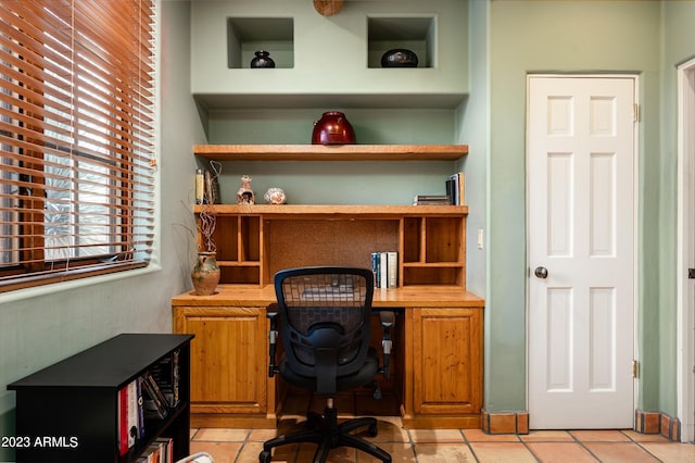 office area featuring light tile flooring