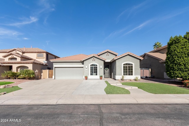 mediterranean / spanish-style house featuring a garage