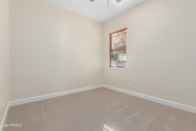 carpeted empty room with ceiling fan