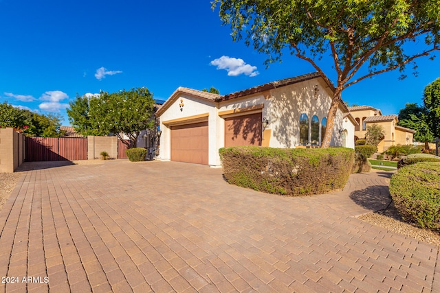 mediterranean / spanish-style house featuring a garage