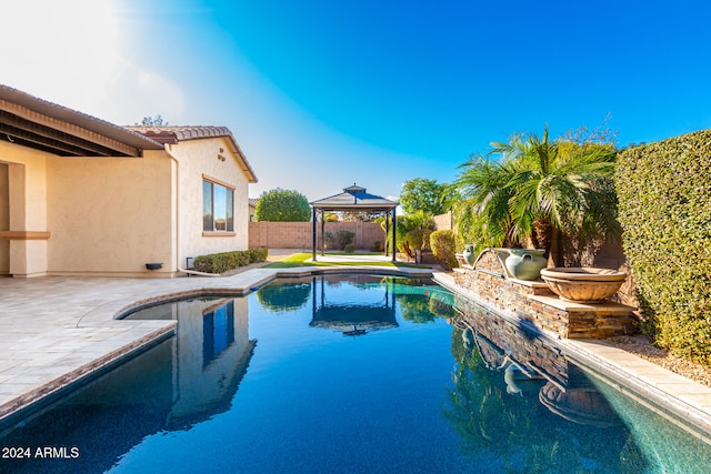 view of pool with a gazebo and a patio area