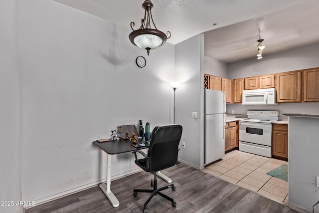2929 W Yorkshire Dr Unit 2074, Phoenix, AZ 85027 - kitchen featuring white appliances, a desk, light wood-type flooring, baseboards, and light countertops