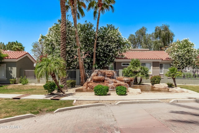 2929 W Yorkshire Dr Unit 2074, Phoenix, AZ 85027 - view of front facade with stucco siding, a tile roof, and fence