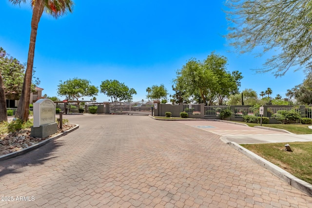 2929 W Yorkshire Dr Unit 2074, Phoenix, AZ 85027 - view of decorative road with curbs, a gated entry, and a gate