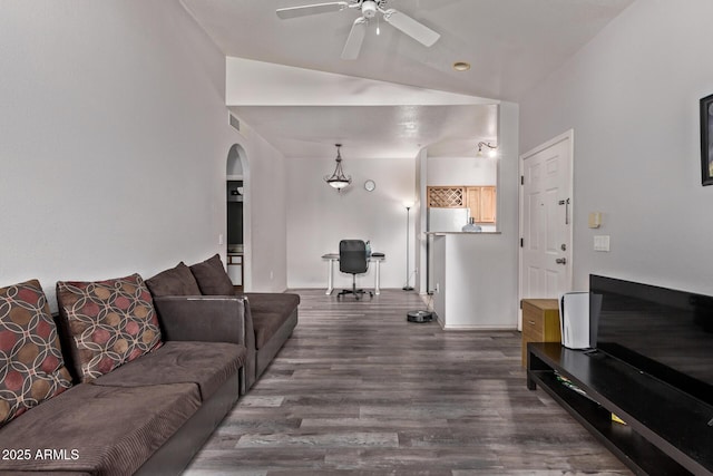 2929 W Yorkshire Dr Unit 2074, Phoenix, AZ 85027 - living area with vaulted ceiling, dark wood-type flooring, arched walkways, ceiling fan, and a desk