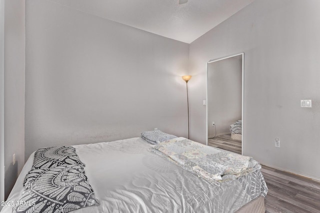 2929 W Yorkshire Dr Unit 2074, Phoenix, AZ 85027 - bedroom featuring vaulted ceiling, wood finished floors, and baseboards