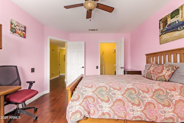 bedroom featuring baseboards, ceiling fan, dark wood-style flooring, and visible vents