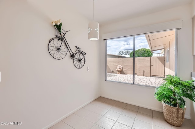 spare room featuring baseboards