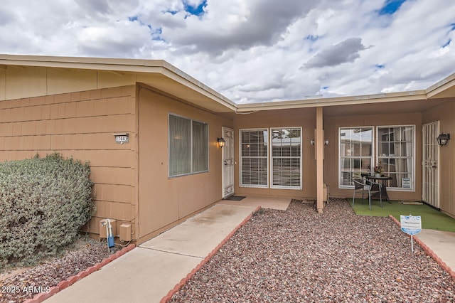 property entrance with a patio area