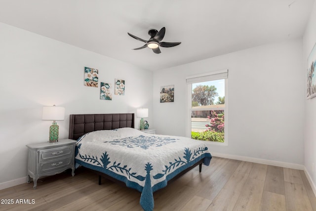 855 S Revolta Cir, Mesa, AZ 85208 - bedroom with baseboards, a ceiling fan, and wood finished floors