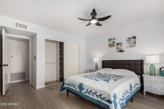 855 S Revolta Cir, Mesa, AZ 85208 - bedroom featuring a closet, wood finished floors, visible vents, a ceiling fan, and baseboards