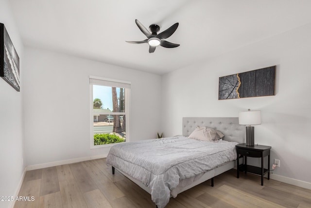 855 S Revolta Cir, Mesa, AZ 85208 - bedroom featuring baseboards, ceiling fan, and wood finished floors