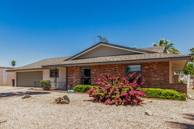 855 S Revolta Cir, Mesa, AZ 85208 - single story home with roof with shingles, brick siding, and a garage