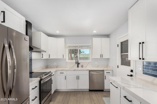 855 S Revolta Cir, Mesa, AZ 85208 - kitchen featuring a sink, wall chimney exhaust hood, light stone countertops, appliances with stainless steel finishes, and recessed lighting