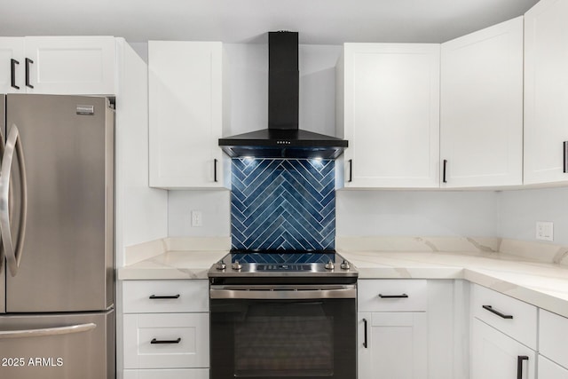 855 S Revolta Cir, Mesa, AZ 85208 - kitchen with stainless steel appliances, wall chimney range hood, light stone counters, white cabinetry, and decorative backsplash