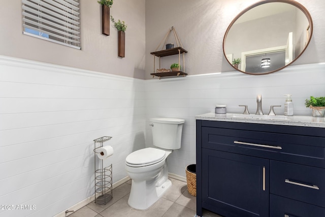 bathroom with tile patterned floors, toilet, and vanity