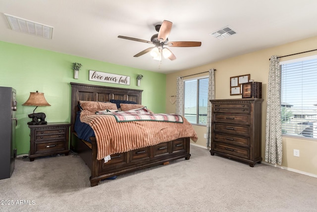 bedroom featuring ceiling fan and light colored carpet