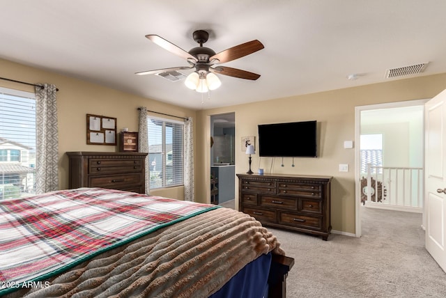 bedroom featuring light colored carpet and ceiling fan