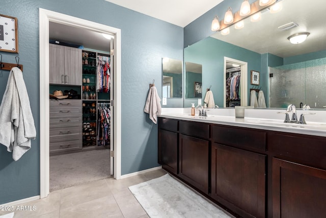 bathroom featuring tile patterned flooring and vanity