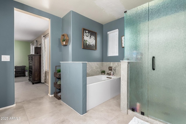 bathroom featuring tile patterned floors and shower with separate bathtub