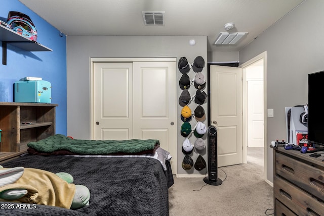 carpeted bedroom featuring a closet