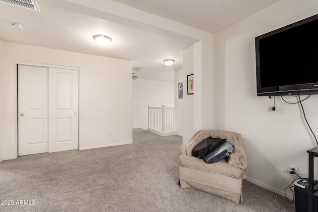 sitting room with light carpet