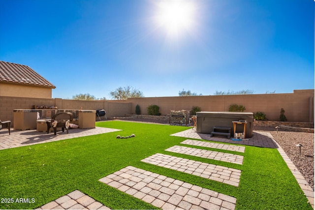 view of yard featuring a hot tub and a patio area