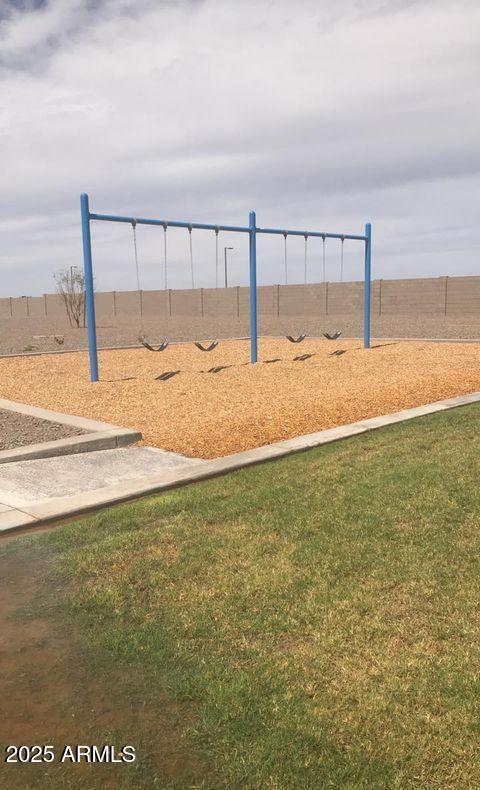 view of property's community featuring a yard and a playground