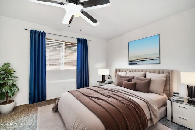 bedroom featuring ceiling fan and carpet