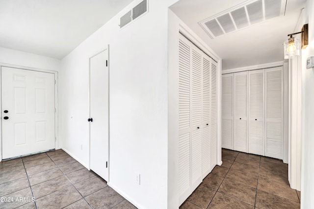 hall featuring tile patterned floors