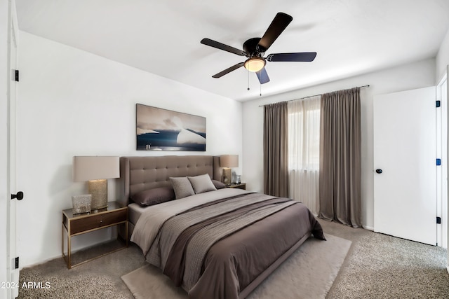 carpeted bedroom featuring ceiling fan