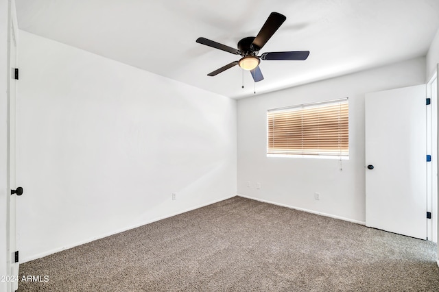 spare room with carpet and ceiling fan