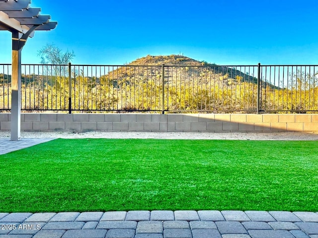 view of yard featuring a pergola and fence