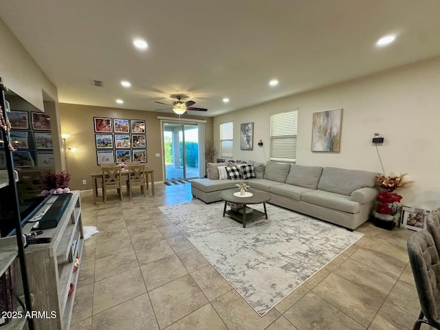 living area featuring recessed lighting, baseboards, light tile patterned flooring, visible vents, and a ceiling fan