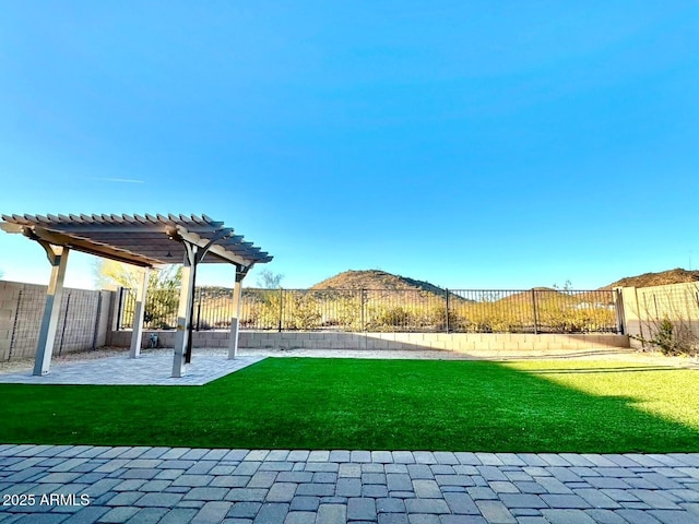 view of yard featuring a patio, a fenced backyard, and a pergola