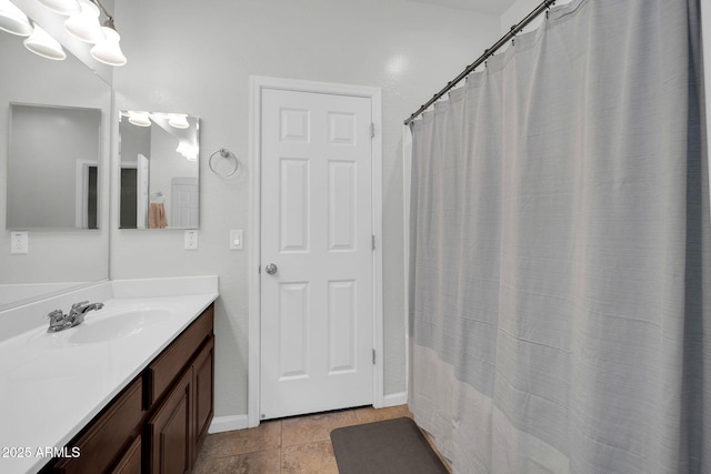 full bathroom featuring tile patterned floors and vanity