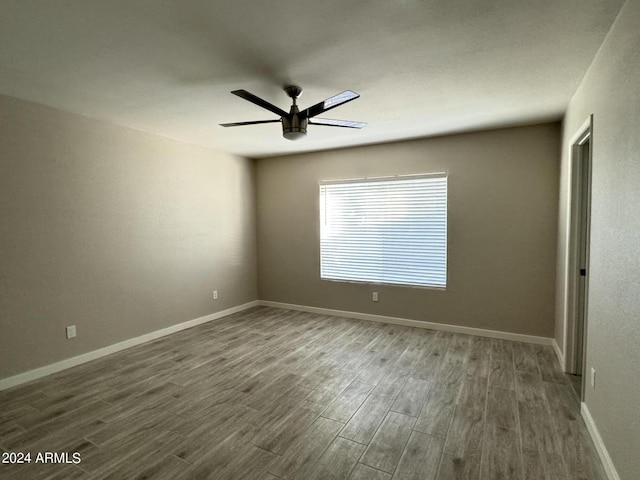 spare room featuring dark hardwood / wood-style floors