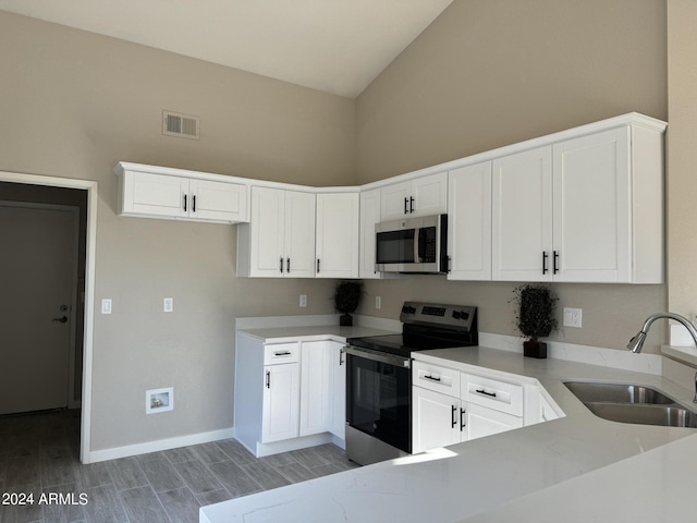 kitchen with white cabinets, sink, and appliances with stainless steel finishes