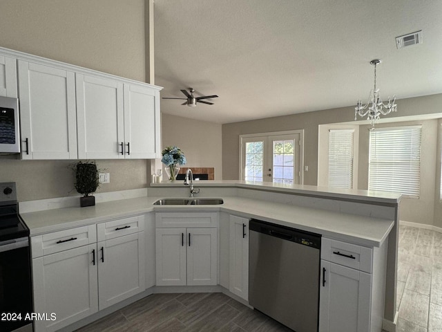 kitchen featuring white cabinetry, sink, kitchen peninsula, and stainless steel appliances