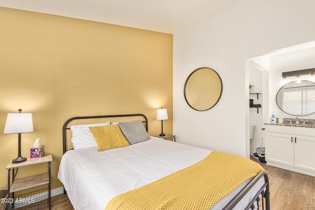 bedroom featuring wood finished floors