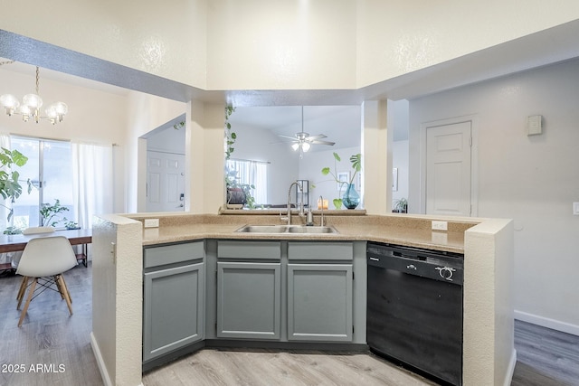 1331 W Baseline Rd Unit 360, Mesa, AZ 85202 - kitchen featuring black dishwasher, gray cabinets, light wood-type flooring, a chandelier, and a towering ceiling
