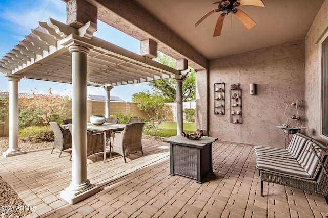 deck featuring ceiling fan, a patio area, and a pergola